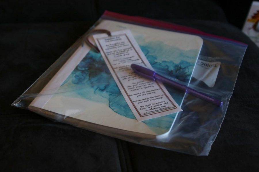 Pictured%3A+A+large+ziplock+bag+with+a+blue+notebook%2C+purple+pen%2C+and+bookmark+with+%E2%80%98guidelines+for+civil+discourse%E2%80%99.