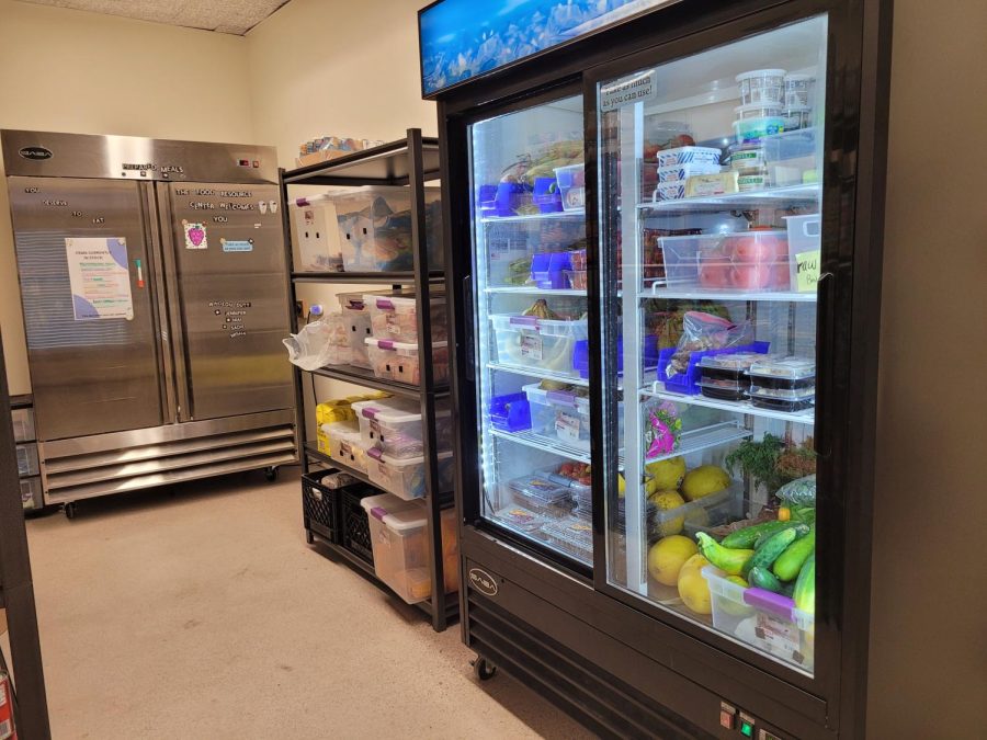 Refrigerators with produce and microwavable meals inside.