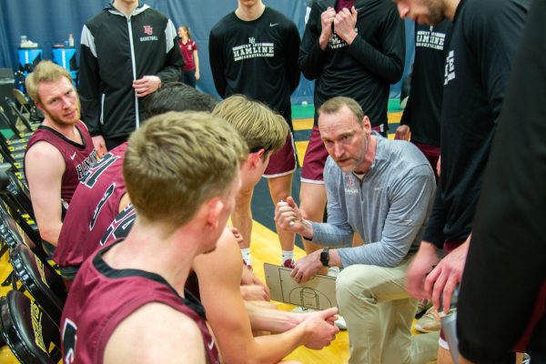 Coach Hayes and company meet during a timeout in a thrilling MIAC title game where the Pipers fell by just one point.