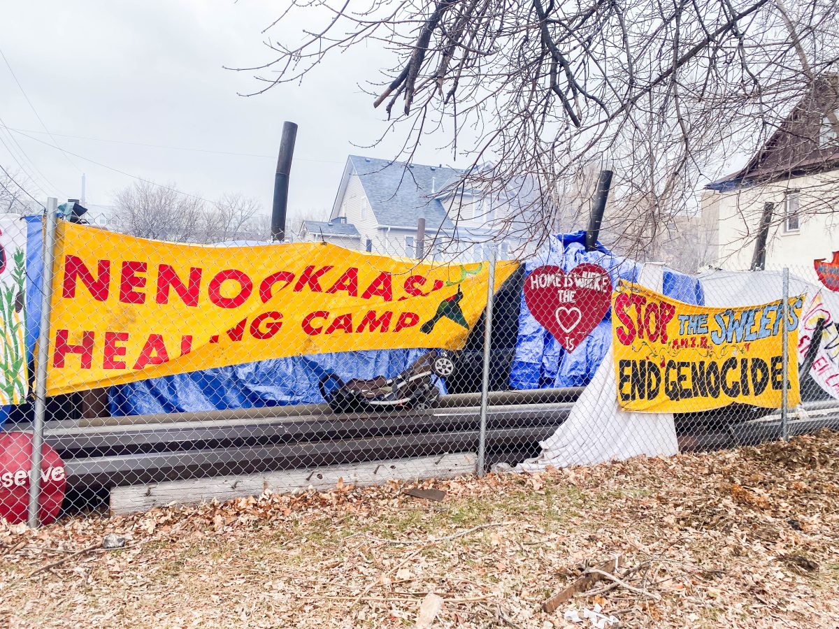 Camp Nenookaasi displayed banners and signs where the camp faces 28th Street in South Minneapolis.