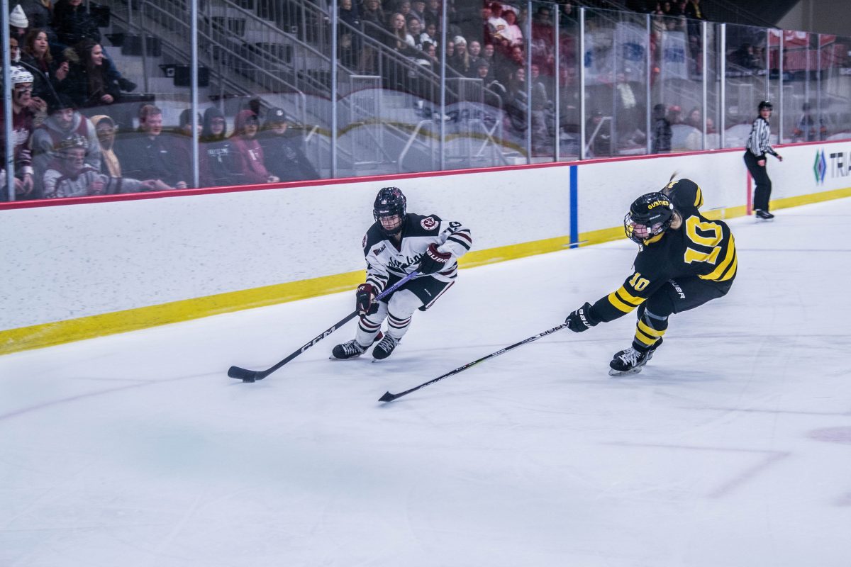 Junior forward Peppi Kahkonen hustles past a Gustie to set up a scoring opportunity late in the second period.