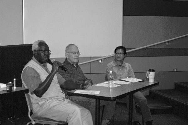 Professor Sam Imbo (left), Dr. Jerry Artz (middle) and Suda Ishida (right) sit together in a panel, answering a series of five questions prompted by the President of the Society of Physics Students.