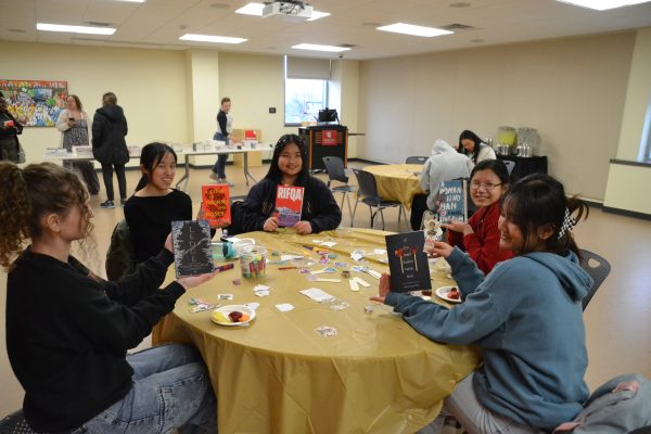 Event attendees showed off the books they received for free while they crafted their bookmarks.