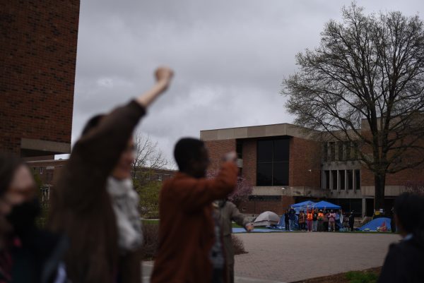 Protestors on the Old Main lawn cheered as SFJ organizers June Gromis (left) and Mohamed Shukri (center) walked toward Anderson Center for their meeting with President Kathleen Murray and Board of Trustees Chair Ellen Watters.