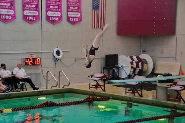 Senior Audrey Tschida mid-air during one of her dives. Tschida ended the meet scoring 128.xx points in the women's 3 meter dive, 124.10 points in the women's 1 meter dive (six dives), and 322.xx points in the women's 1 meter dive (11 dives).