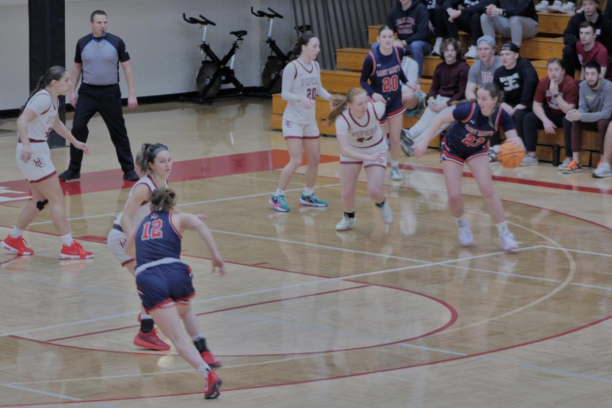 Piper defenders rush into defensive formation to slow down pressure from the Cardinal offense in Hamline's 73-61 first round victory over St. Marys University.