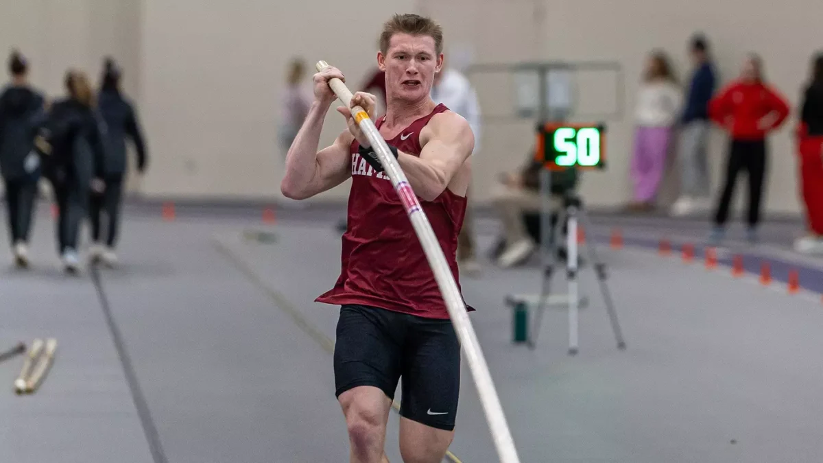 Sophomore Austin Schloder competing in the pole vault event at the MIAC indoor championship. Schloder won the competition with a vault of 4.55 meters.