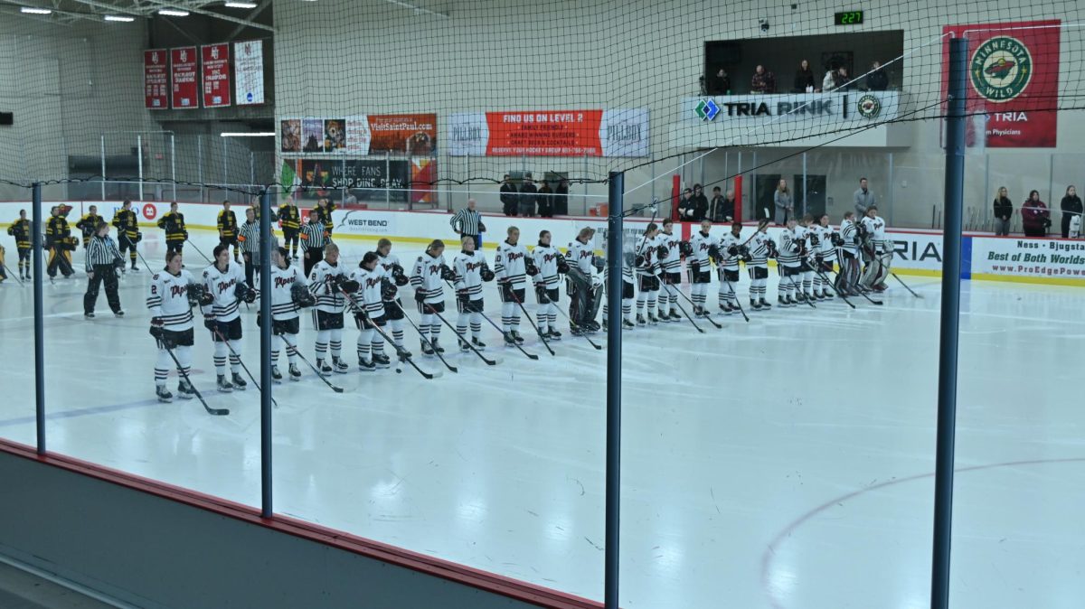 All team members in attendance on the ice ready to begin the first period of the game.