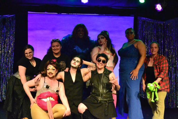 (Clockwise from top left) Stage hand Zach Schrom, stage manager/producer and drag club secretary sophomore Trina Morlock, Lala, Mizz Harvey Wallbanger, Gingey, Hopper, Skye McMann, Twilight and Zestina the Drag Queen gather at the end of the show and pose for photos.