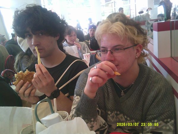 Seniors Isaac Roy (left) and Aiden Lewald (right) munch away at In-and-Out Burger in San Francisco, California. The team, plus their successors and their Sports Editor, traveled across the country for the 2026 Associated Collegiate Press Conference, where they not only learned, presented, and won awards relating to journalism, but also got to be tourists in a historic city.