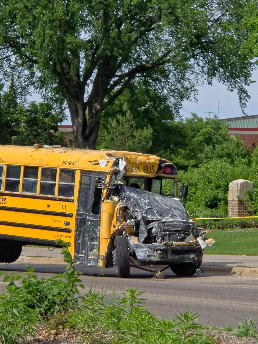 The wrecked bus was towed out of the building before 5pm Tuesday.
